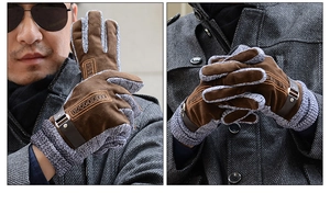 Detail of men's leather and knit gloves with brown suede textures and wrist buckle