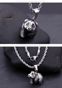 Macro shot of vintage panda pendant showing detailed fur texture and twisted rope chain