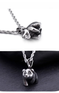 Detailed views of a vintage panda pendant with rugged texture and antique silver finish