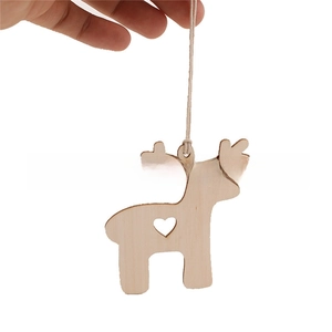 Detailed macro view of laser-cut boxwood reindeer pendant with a heart-shaped cutout