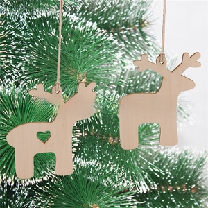 Detail of laser-cut wooden reindeer ornaments with hollow heart on a festive tree
