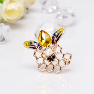 Elegant gold bee brooch with yellow gemstone, pearl head and colorful enamel wings