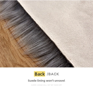 Macro detail of plush heart rug featuring a beige suede backing and reinforced edges