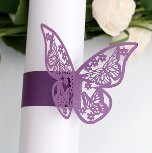 Macro view of purple laser-cut butterfly napkin ring with floral hollow patterns