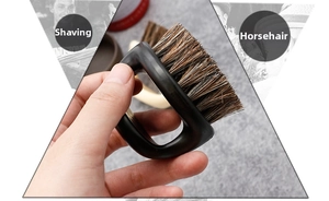 Detail of horse hair beard brush with black matte D-shaped handle for men grooming