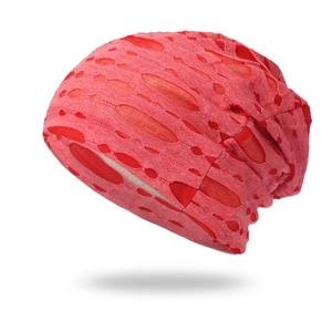 Close-up of red knit beanie with hollowed-out double-layer distressed texture