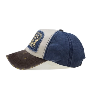 Side view of retro washed denim baseball cap with navy, beige and brown color blocking