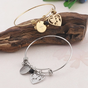 Adjustable Mother's Day bangle set in gold and silver with heart and logo charms