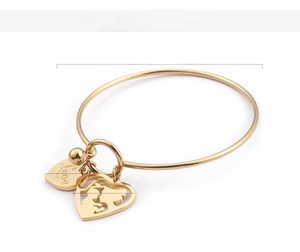 Detail of 18K gold plated heart charms with Love engraving and mother-child cutout design