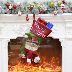 Festive Christmas stocking with snowman doll on a cozy fireplace mantel decoration