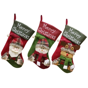 Three large Christmas stockings with Santa, Snowman and Reindeer on a white background