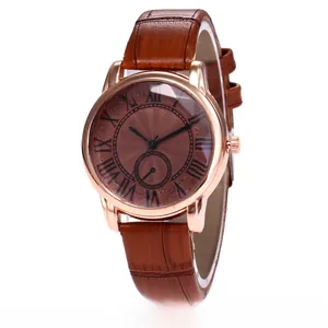 Detail of a ladies quartz watch with brown roman numeral dial and crocodile leather strap