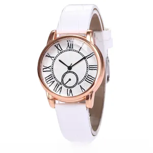 Detail of rose gold ladies watch with white roman numerals dial and crocodile leather strap