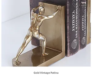 Detail of creative golden bookend featuring a pushing figure in vintage antique finish