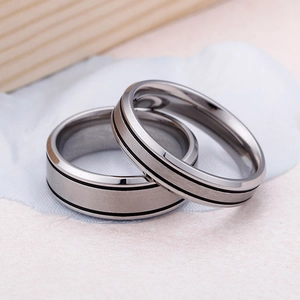 Titanium steel couple rings with brushed matte finish and black parallel grooves