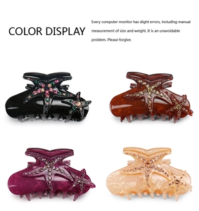 Detail view of blue starfish hair claws in four colors with sparkling rhinestone accents