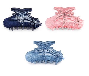 Detailed view of blue and pink starfish hair claws with sparkling rhinestones and texture
