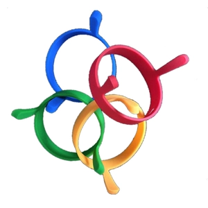 Set of four colorful silicone round fried egg molds with handles in red blue yellow and green