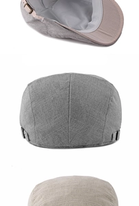 Detail of linen beret with metal side buckle and striped lining in classic flat cap design
