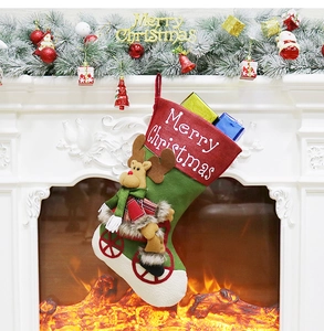 Detail of Christmas stocking with red cuff, Merry Christmas embroidery and 3D reindeer doll