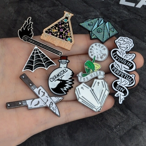 Creative 9-piece set of enamel pins featuring goth, science, and botanical designs