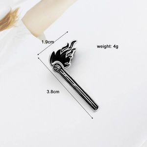 Detail view of black matchstick enamel pin with size measurements 1.9cm by 3.8cm