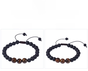 Detailed view of 8mm volcanic stone and tiger eye bead bracelets with adjustable cord