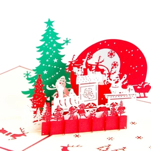 3D pop-up Christmas card featuring Santa Claus, reindeer, and a gift train on red cardstock