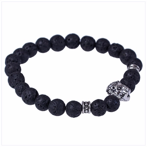 Close-up of 8mm black lava stone beads and a silver lion head charm on an elastic bracelet