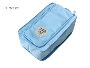 Detail of Milky Sky travel shoe bag showing waterproof fabric and woven logo label