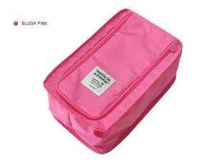Detail view of the blush pink waterproof shoe bag with zipper closure and brand logo