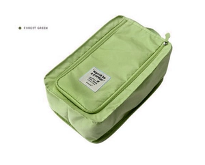 Detail of forest green waterproof travel shoe bag with zipper closure and carry handle