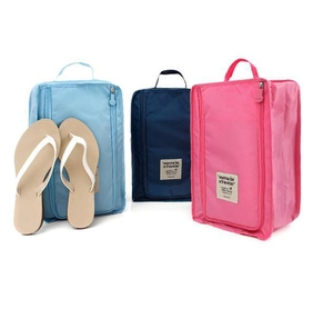 Waterproof travel shoe bags in multiple colors with top handles and U-shaped zippers