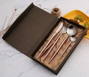 Pink and silver 4-piece stainless steel cutlery set in a brown gift box with gold lining