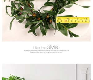 Detail view of 18 inch artificial olive leaf wreath with ruler showing product dimensions