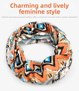 Detailed view of jacquard neck warmer with geometric patterns in orange and blue