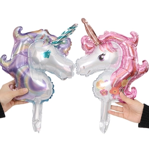 Pair of colorful unicorn head foil balloons for children birthday party decorations