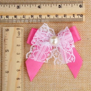 Detail showing pink satin and lace bow with pearl center measuring 5.5cm for DIY hair crafts