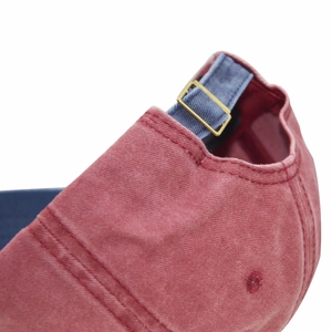Washed cotton baseball cap in red and blue contrast with adjustable metal buckle