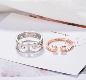 Detail of S925 sterling silver couple rings showing the wave patterns and inner engraving