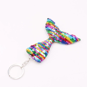 Detail of colorful reversible sequins on mermaid tail keychain with a metal ring