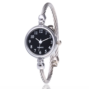 Detail of silver twisted cable bracelet watch with black dial and Arabic numerals