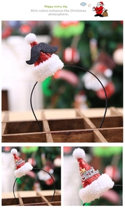 Detail of Christmas headband with mini sequin Santa hat, black beard and gold star