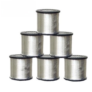 Pyramid stack of silver jewelry wire spools with transparent protective film