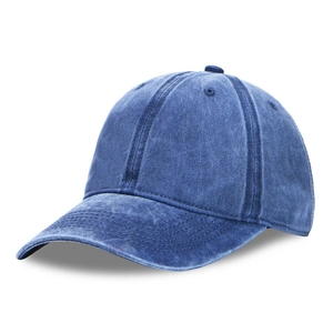 Close-up of washed dark blue denim baseball cap showing fabric texture and visor stitching