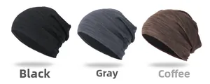 Close-up of lightweight knitted beanies in black, grey, and coffee brown colors