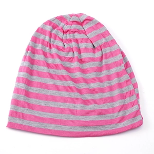 Macro detail of pink and grey striped lightweight knit fabric on this casual beanie