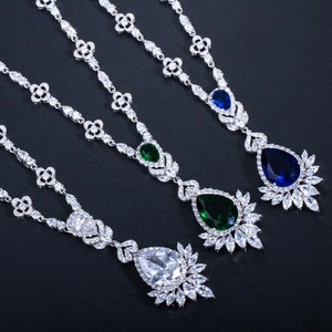 Detailed view of pear-cut necklaces in white, green, and blue cubic zirconia stones