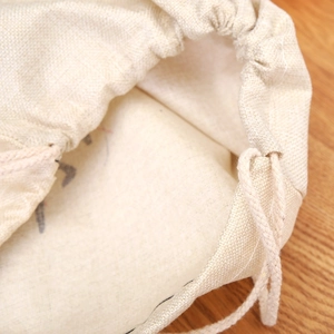 Large linen Christmas drawstring gift bag with durable jute rope and rustic texture