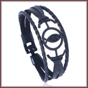Macro shot of black multi-strand faux leather bracelet with metal 'JESUS' charm detail